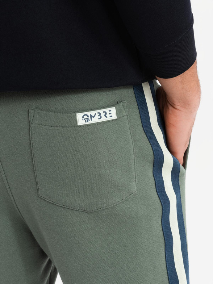 Men's sweatpants with piping and leg ribbing - olive V2 OM-PASK-0258