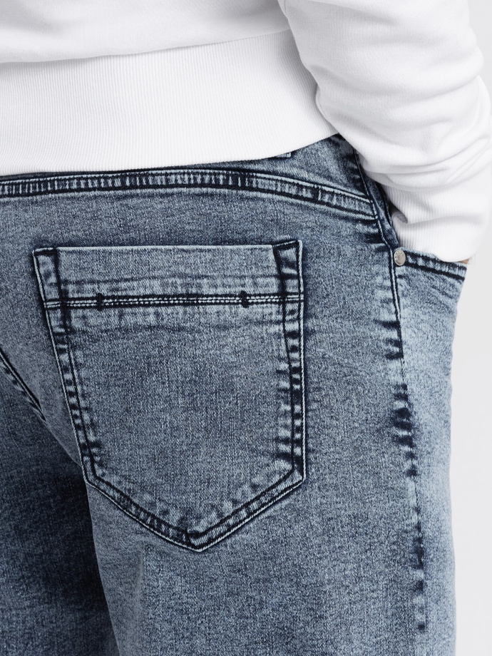 Męskie spodnie jeansowe marmurkowe z surowo wykończoną nogawką SLIM FIT - ciemnoniebieskie V4 OM-PADP-0146