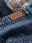 Męskie jeansowe spodnie TAPERED FIT z dziurami – ciemnoniebieskie V3 OM-PADP-0175