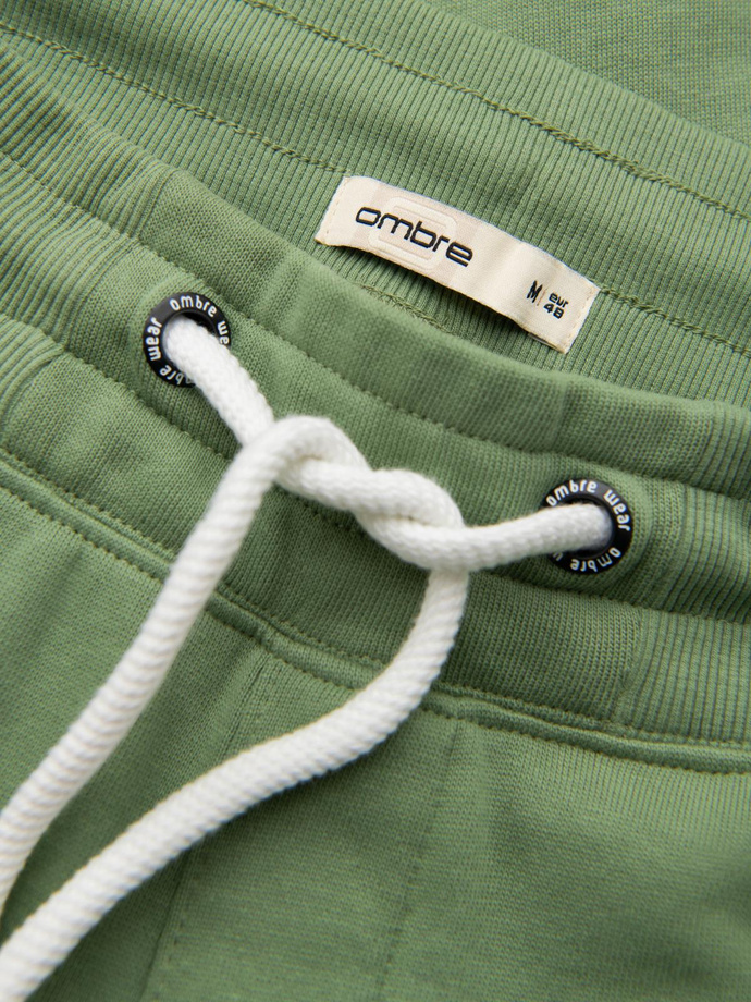 Spodnie męskie dresowe typu jogger - zielone V3 OM-PABS-0173